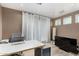 Well-lit office features neutral colors, white drapes, modern furniture and a TV area at 2319 N 58Th St, Scottsdale, AZ 85257