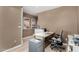 Home office with a white desk, neutral walls and artwork creating a dedicated workspace at 2319 N 58Th St, Scottsdale, AZ 85257