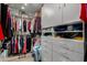 Spacious walk-in closet with custom shelving, drawers, and ample storage space at 2319 N 58Th St, Scottsdale, AZ 85257