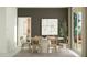 Elegant dining area with modern furniture, stylish decor, and easy access to the outdoor patio at 23361 W Atlanta Ave, Buckeye, AZ 85326