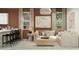 Comfortable living room with a modern design, stylish decor, and ample natural light from large windows at 23361 W Atlanta Ave, Buckeye, AZ 85326