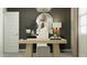 Well-lit home office with a modern desk, stylish decor, and a comfortable workspace at 23361 W Atlanta Ave, Buckeye, AZ 85326