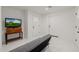 Finished basement with modern marble floors and a large screen television at 2350 E Melrose St, Gilbert, AZ 85297