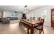 Bright dining room boasts a long wooden table with bench seating and a modern light fixture at 2350 E Melrose St, Gilbert, AZ 85297