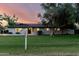 Charming single-story home featuring a well-manicured lawn and mature trees at 2350 E Melrose St, Gilbert, AZ 85297