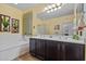Bathroom with a separated shower and bathtub, double sink vanity, and tile flooring at 2422 W Maya Way, Phoenix, AZ 85085