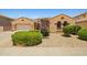 Charming single-story home featuring a two-car garage, desert landscaping, and warm, inviting curb appeal at 2422 W Maya Way, Phoenix, AZ 85085