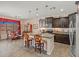 Well-appointed kitchen with granite countertops, dark cabinetry, stainless steel appliances, and breakfast bar seating at 2422 W Maya Way, Phoenix, AZ 85085