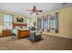 Main bedroom showcasing a bed with decorative pillows, carpet floor, ceiling fan, and lots of natural light at 2422 W Maya Way, Phoenix, AZ 85085