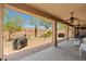 The covered patio shows the brick-paved space and the meticulously landscaped desert backyard at 2422 W Maya Way, Phoenix, AZ 85085