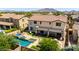 Spacious backyard with pool, spa, covered patio, and mountain views, creating a private retreat at 2460 E Crescent Way, Gilbert, AZ 85298