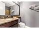 Bathroom featuring a granite countertop vanity and a toilet at 2460 E Crescent Way, Gilbert, AZ 85298
