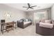 Cozy bedroom with a daybed, desk, and ceiling fan at 2460 E Crescent Way, Gilbert, AZ 85298