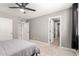 Bedroom with carpet, windows with black-out curtains, and gray walls with a walk-in closet at 2460 E Crescent Way, Gilbert, AZ 85298
