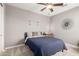 Cozy bedroom with a black bed frame and a nightstand at 2460 E Crescent Way, Gilbert, AZ 85298
