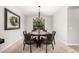 Cozy dining room featuring a round wooden table with seating for six and a decorative wreath at 2460 E Crescent Way, Gilbert, AZ 85298