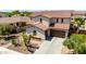 Beautiful home with a tile roof, mature desert landscaping, and a spacious driveway at 2460 E Crescent Way, Gilbert, AZ 85298