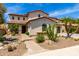 Stunning two-story home featuring desert landscaping with a tiled roof and charming curb appeal at 2460 E Crescent Way, Gilbert, AZ 85298