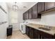 Functional laundry room with cabinets and a sink at 2460 E Crescent Way, Gilbert, AZ 85298