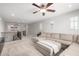 Upstairs living area with a large sectional sofa, neutral walls, and stylish accents at 2460 E Crescent Way, Gilbert, AZ 85298