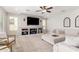 Bright living room featuring a built-in entertainment center and comfortable seating arrangement at 2460 E Crescent Way, Gilbert, AZ 85298