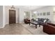 Comfortable living room with stylish furniture, natural light, and neutral color palette at 2460 E Crescent Way, Gilbert, AZ 85298