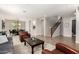 Spacious living room with open floor plan connecting to the dining area and staircase at 2460 E Crescent Way, Gilbert, AZ 85298