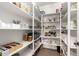 Well-organized walk-in pantry with white shelving providing ample storage space at 2460 E Crescent Way, Gilbert, AZ 85298