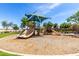 Community playground with slides, climbing structures, and a shaded area for children to enjoy at 2460 E Crescent Way, Gilbert, AZ 85298