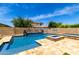 Backyard pool featuring a water feature, basketball hoop, in-pool fire pit, and stone accents at 2460 E Crescent Way, Gilbert, AZ 85298