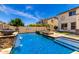 Backyard pool with a water feature, spa, and basketball hoop, perfect for outdoor fun and relaxation at 2460 E Crescent Way, Gilbert, AZ 85298