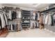 Spacious walk-in closet with abundant hanging space, shelving, and organized storage solutions at 2460 E Crescent Way, Gilbert, AZ 85298