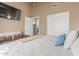Comfortable bedroom showcasing a plush bed, white linens, accent pillows and a large closet at 24813 N 55Th Dr, Glendale, AZ 85310