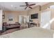 Another view of the bedroom with hardwood floors and comfortable sofa at 24813 N 55Th Dr, Glendale, AZ 85310