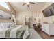 Cozy bedroom featuring a comfortable bed, ensuite bathroom, and stylish decor at 24813 N 55Th Dr, Glendale, AZ 85310