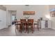 Dining area features a wooden table with seating for six and modern decor at 24813 N 55Th Dr, Glendale, AZ 85310