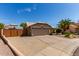 Single-story house with desert landscaping, a two-car garage, and neutral exterior at 24813 N 55Th Dr, Glendale, AZ 85310