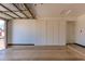 Bright and spacious garage with ample built-in storage cabinets along the back wall at 24813 N 55Th Dr, Glendale, AZ 85310