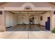 Spacious garage with ample storage, featuring clean epoxy flooring, utility sink, and water heater at 24813 N 55Th Dr, Glendale, AZ 85310