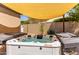 Inviting backyard hot tub with partial sun shade for relaxing outdoor enjoyment at 24813 N 55Th Dr, Glendale, AZ 85310