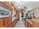 Modern kitchen with wooden cabinets, granite countertops, and stainless steel appliances at 24813 N 55Th Dr, Glendale, AZ 85310