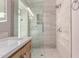 Spa-like shower with tile surround, dual showerheads, and modern fixtures at 24813 N 55Th Dr, Glendale, AZ 85310