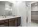 New bathroom with dual sinks, walk-in closet, and separate room with toilet for added convenience at 25096 N 154Th Ln, Surprise, AZ 85387