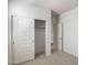 A bedroom features a walk-in closet with sliding doors providing storage solutions and organization at 25096 N 154Th Ln, Surprise, AZ 85387