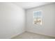 Sunlit bedroom features a window with views offering a tranquil and inviting space for relaxation at 25096 N 154Th Ln, Surprise, AZ 85387
