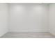 Bright, minimalist room with neutral paint, tile floors, and simple electrical outlets at 25096 N 154Th Ln, Surprise, AZ 85387