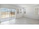 Bright living space with sliding glass doors leading to the yard; and large windows and tile flooring at 25096 N 154Th Ln, Surprise, AZ 85387
