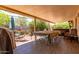 This covered patio boasts a backyard dining area, grill, and hot tub at 2716 S Terrace Rd, Tempe, AZ 85282