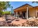 Enjoy outdoor living in this backyard featuring a cozy patio, dining area and mature trees at 2716 S Terrace Rd, Tempe, AZ 85282