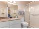 Bathroom with granite countertops, updated fixtures and a tiled walk in shower at 2716 S Terrace Rd, Tempe, AZ 85282